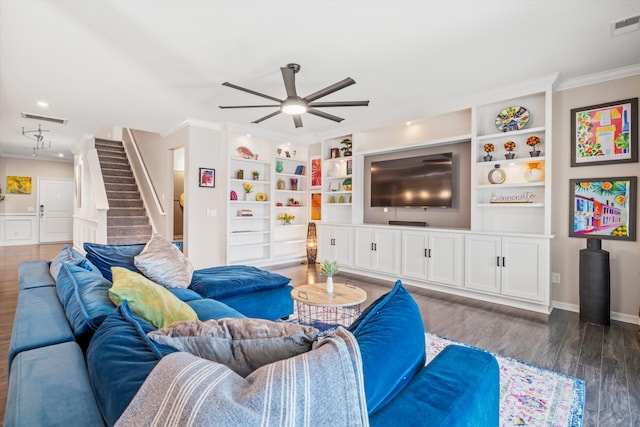 living room featuring visible vents, crown molding, and wood finished floors