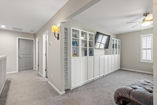 interior space with carpet floors, visible vents, and a wealth of natural light