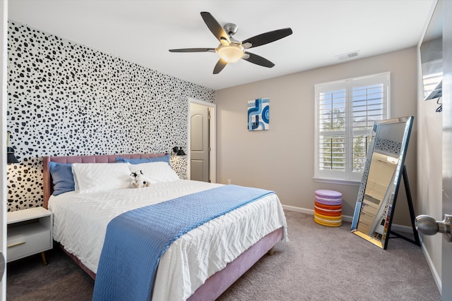 bedroom featuring carpet floors, a ceiling fan, visible vents, and baseboards