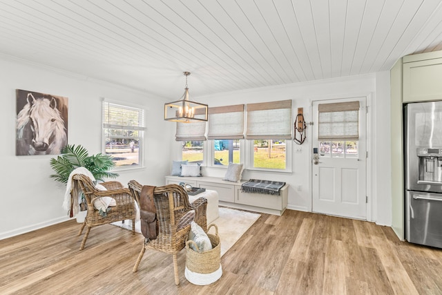 dining area featuring a chandelier, light hardwood / wood-style flooring, wooden ceiling, and crown molding