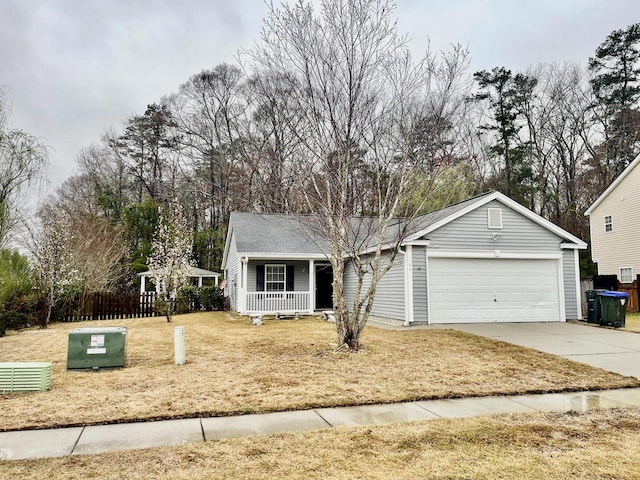 single story home featuring a porch, concrete driveway, fence, and an attached garage