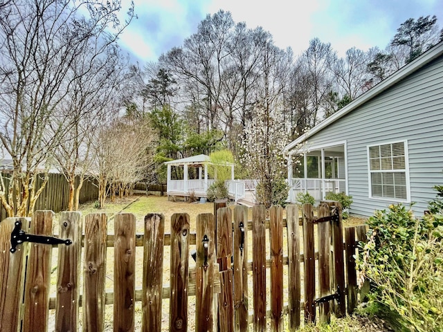 view of yard with a gate and a fenced backyard