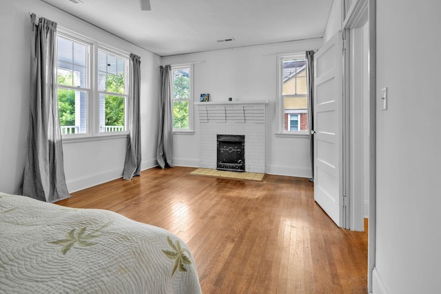 2122 Tugaloo Ave Unit 2120, Columbia, SC 29205 - bedroom featuring wood finished floors, a fireplace, and baseboards