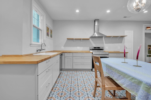2122 Tugaloo Ave Unit 2120, Columbia, SC 29205 - kitchen with open shelves, wall chimney exhaust hood, wooden counters, a sink, and recessed lighting