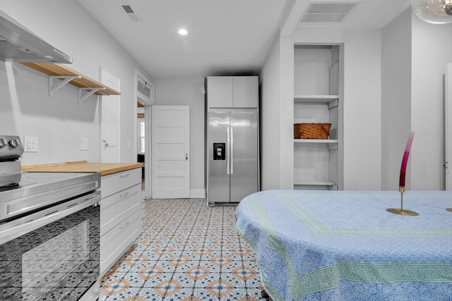 2122 Tugaloo Ave Unit 2120, Columbia, SC 29205 - bedroom with stainless steel fridge with ice dispenser, light flooring, and recessed lighting