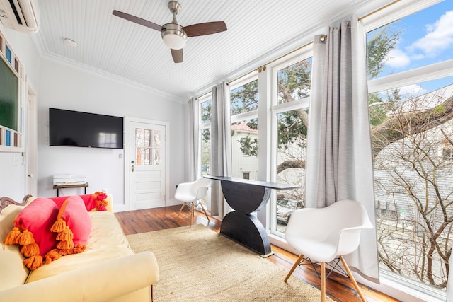 sunroom with ceiling fan and a wall mounted AC