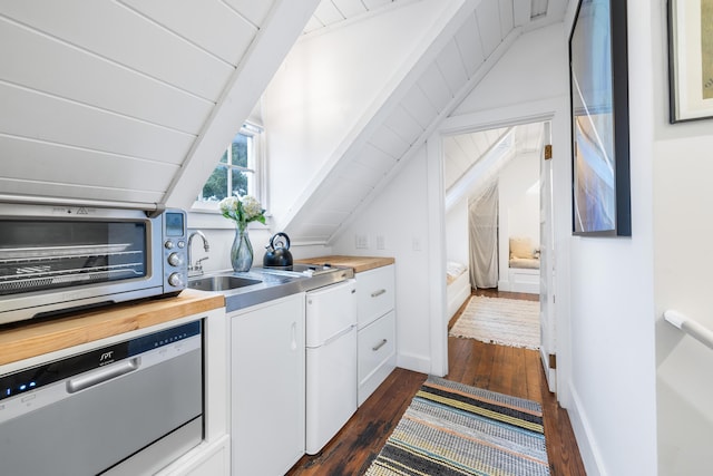 kitchen with dishwasher, dark wood-type flooring, wood counters, and white cabinetry