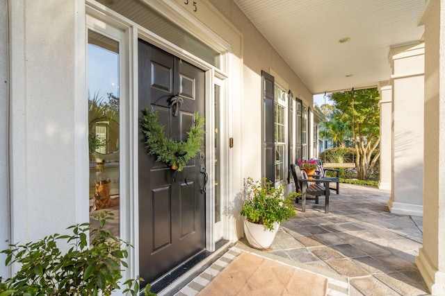 doorway to property with a porch