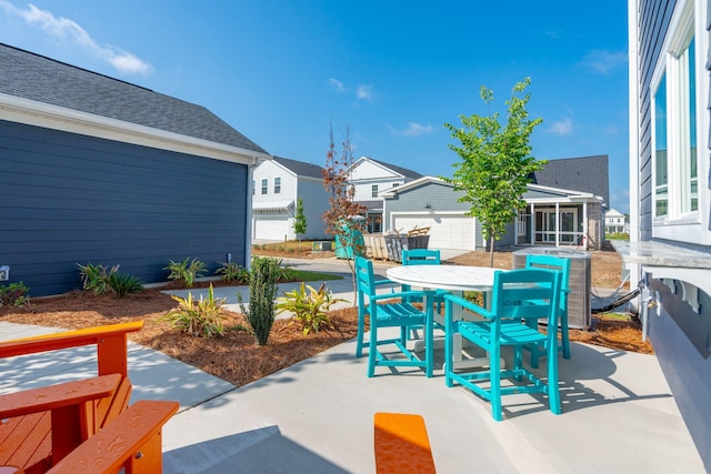 view of patio with outdoor dining space, fence, and central air condition unit