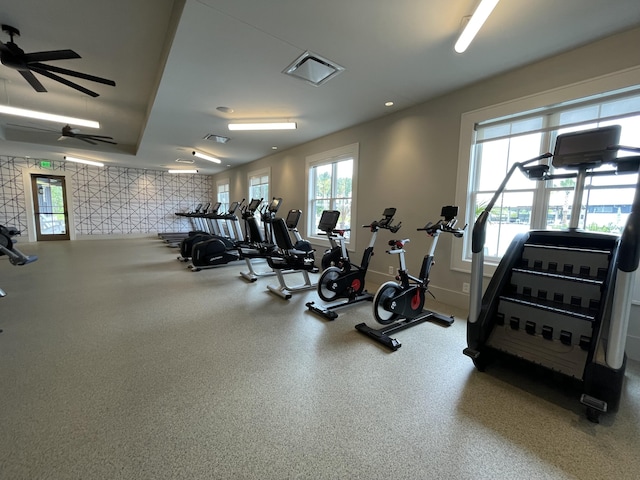 workout area with recessed lighting, baseboards, and wallpapered walls