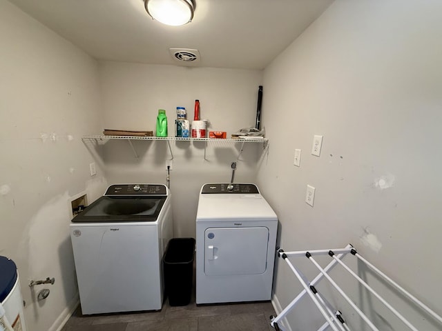 laundry area featuring laundry area, visible vents, and independent washer and dryer