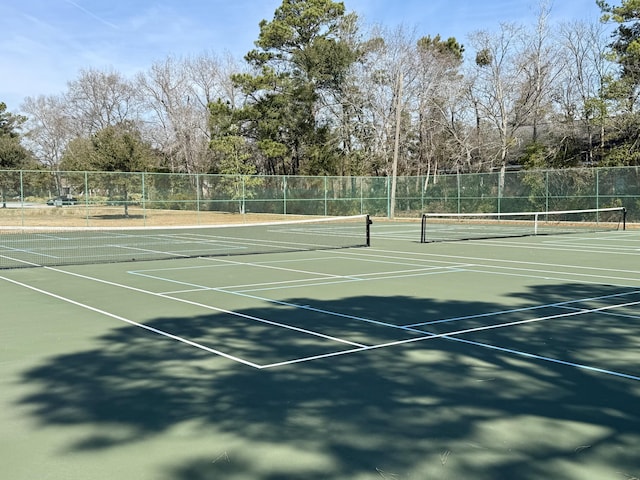 view of sport court with fence