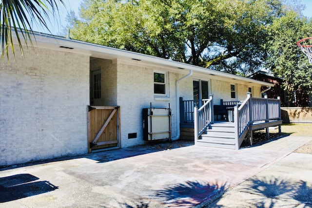 exterior space featuring brick siding