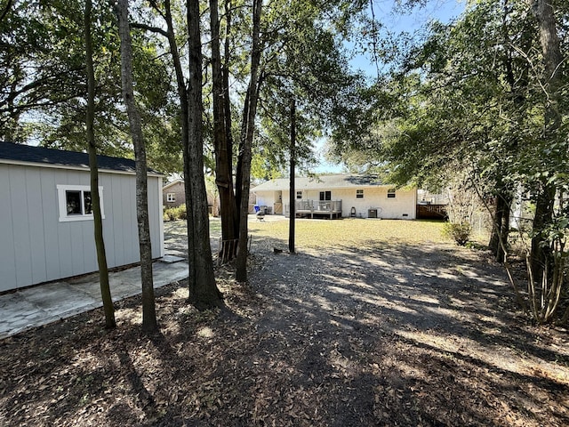 view of yard with a wooden deck