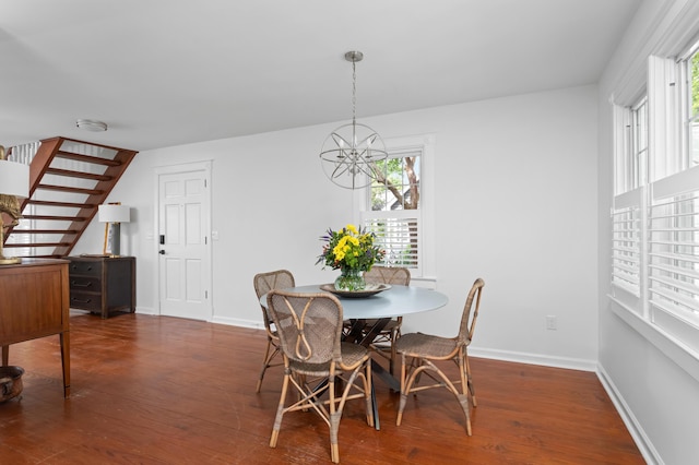 1514 Village Sq, Mount Pleasant, SC 29464 - dining area with wood finished floors, a chandelier, and baseboards
