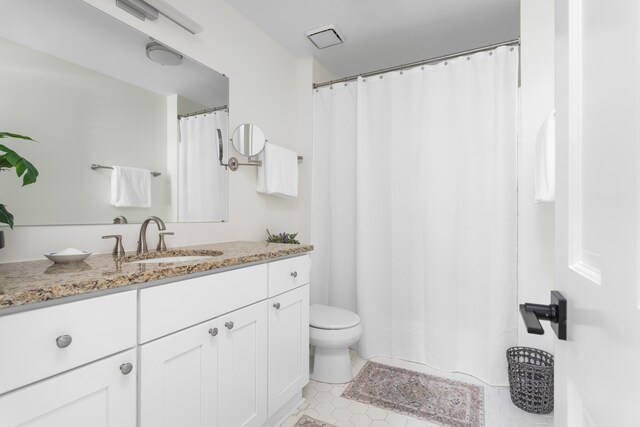 1514 Village Sq, Mount Pleasant, SC 29464 - bathroom featuring toilet, vanity, and tile patterned flooring