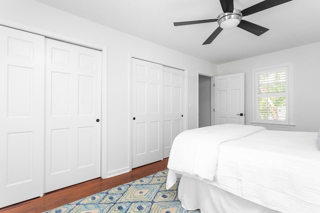 1514 Village Sq, Mount Pleasant, SC 29464 - bedroom with two closets, wood finished floors, and a ceiling fan