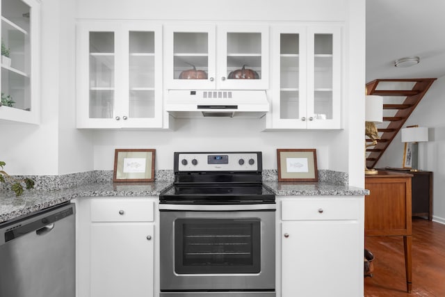 1514 Village Sq, Mount Pleasant, SC 29464 - kitchen featuring under cabinet range hood, stainless steel appliances, white cabinetry, and light stone countertops