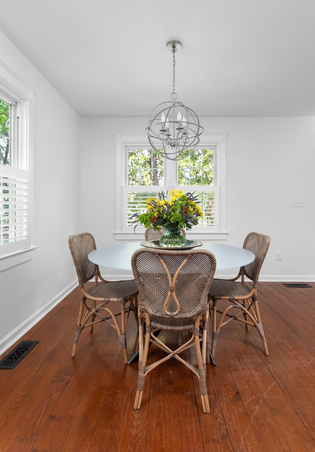 1514 Village Sq, Mount Pleasant, SC 29464 - dining space with a chandelier, hardwood / wood-style floors, and baseboards