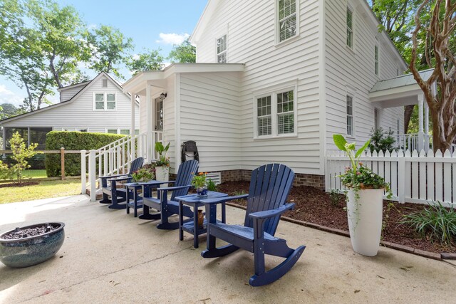1514 Village Sq, Mount Pleasant, SC 29464 - view of patio featuring a fire pit and fence