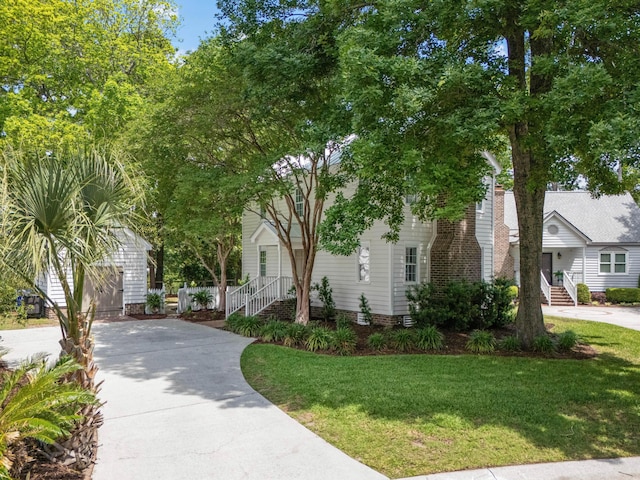 1514 Village Sq, Mount Pleasant, SC 29464 - view of property hidden behind natural elements featuring driveway and a front yard