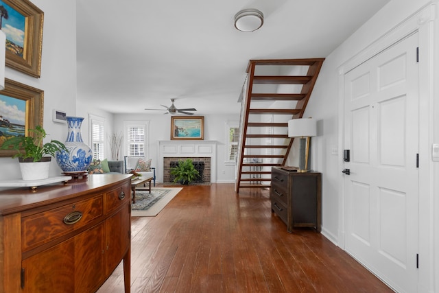1514 Village Sq, Mount Pleasant, SC 29464 - entrance foyer featuring ceiling fan, dark wood-type flooring, a brick fireplace, and baseboards