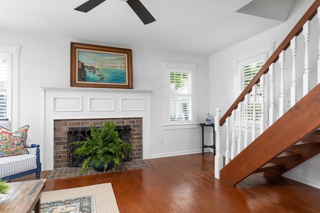 1514 Village Sq, Mount Pleasant, SC 29464 - living room featuring stairway, hardwood / wood-style flooring, ceiling fan, and a brick fireplace