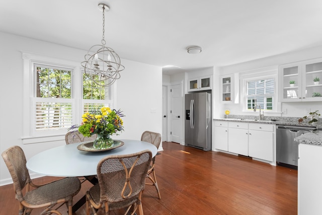 1514 Village Sq, Mount Pleasant, SC 29464 - dining area with a chandelier, dark wood finished floors, and plenty of natural light
