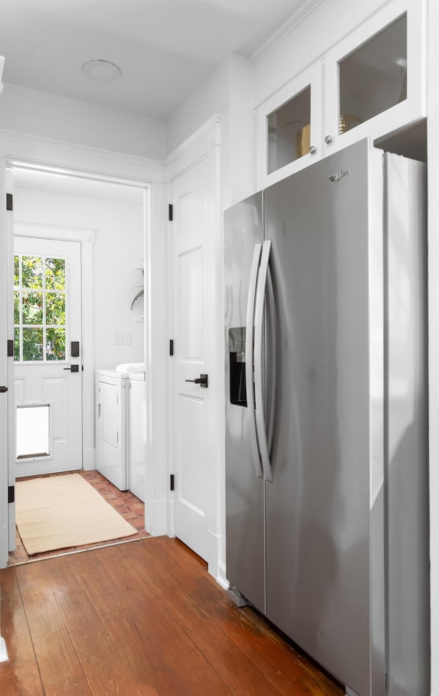 1514 Village Sq, Mount Pleasant, SC 29464 - kitchen with stainless steel refrigerator with ice dispenser, washing machine and dryer, dark wood-style flooring, white cabinets, and glass insert cabinets