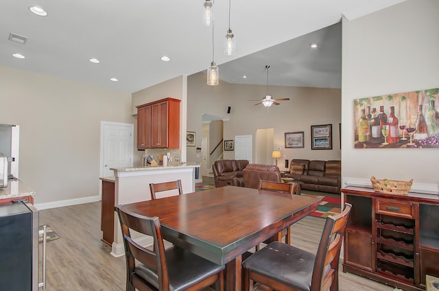 3801 Canary Ct, North Charleston, SC 29420 - dining room featuring a ceiling fan, light wood-style flooring, high vaulted ceiling, recessed lighting, and baseboards