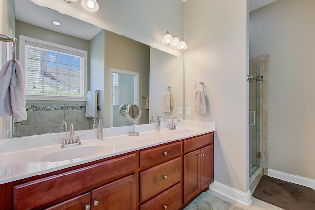 3801 Canary Ct, North Charleston, SC 29420 - bathroom featuring a shower stall, double vanity, and baseboards