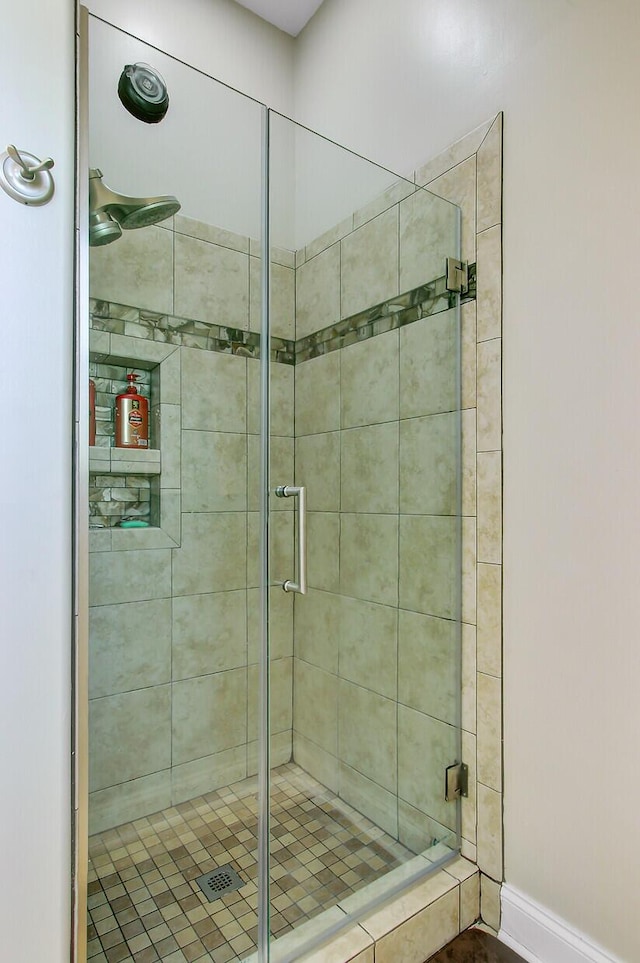 3801 Canary Ct, North Charleston, SC 29420 - bathroom featuring a stall shower and baseboards