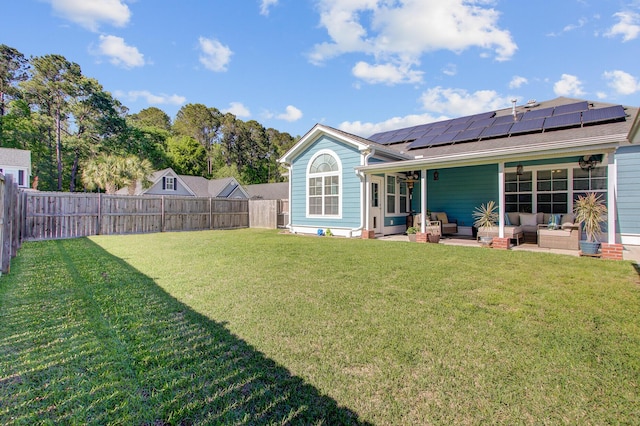 3801 Canary Ct, North Charleston, SC 29420 - back of property with an outdoor hangout area, solar panels, a patio, and a shingled roof