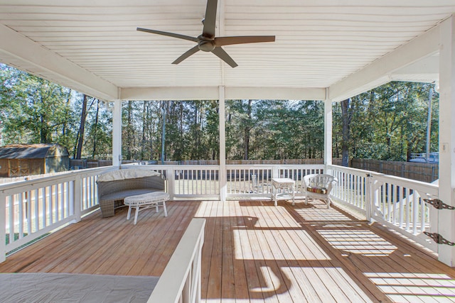 wooden terrace featuring ceiling fan