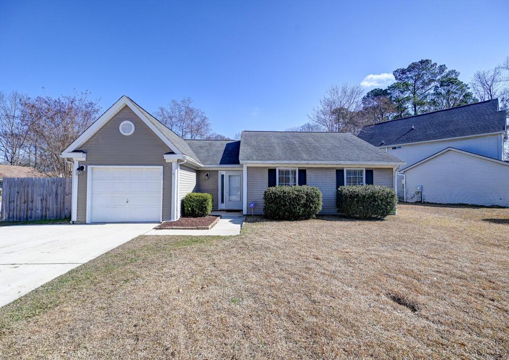 ranch-style home featuring a garage