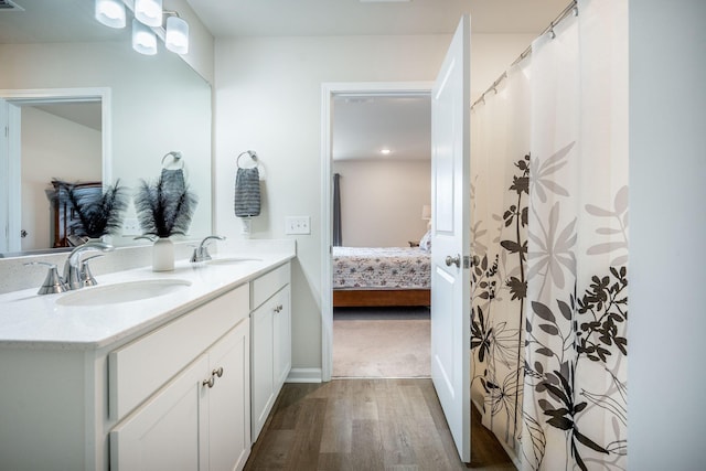 141 Pine Crest View Dr, Summerville, SC 29486 - bathroom featuring double vanity, ensuite bath, wood finished floors, and baseboards