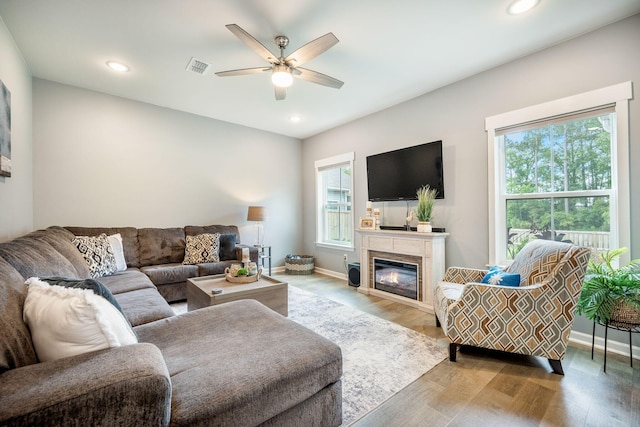 141 Pine Crest View Dr, Summerville, SC 29486 - living area with ceiling fan, light wood-style flooring, a glass covered fireplace, recessed lighting, and baseboards