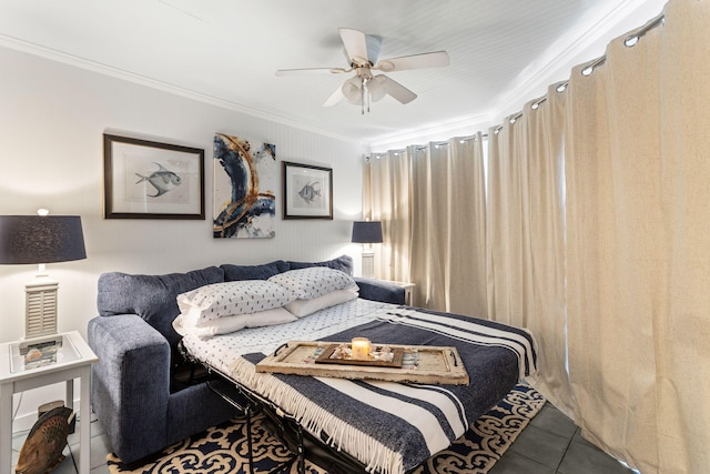 tiled bedroom with a ceiling fan and ornamental molding