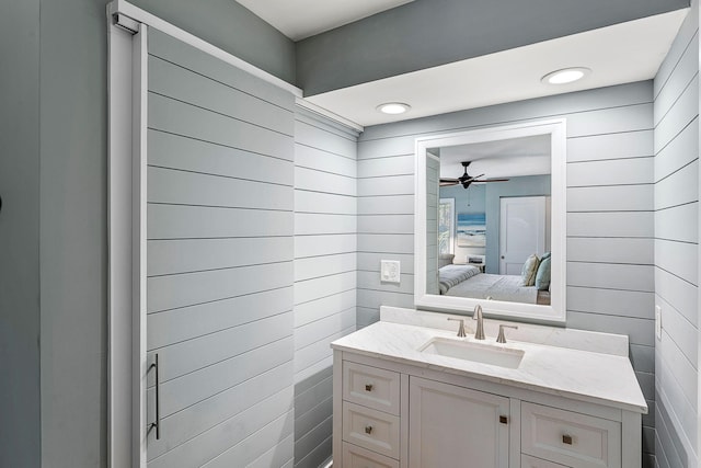 bathroom with ceiling fan and vanity