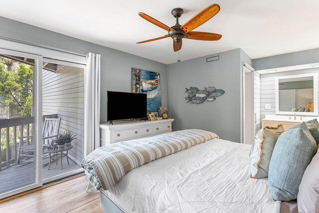 bedroom with access to exterior, light hardwood / wood-style flooring, ceiling fan, and multiple windows