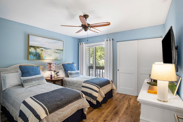 bedroom with hardwood / wood-style flooring, a closet, access to exterior, and ceiling fan