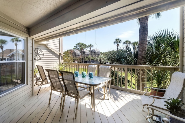 wooden deck with outdoor dining space