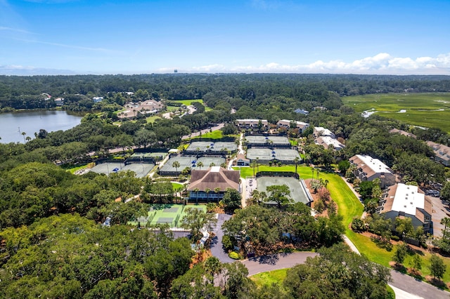 birds eye view of property featuring a view of trees and a water view