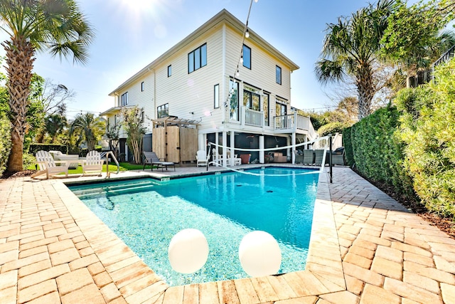 view of pool with a fenced in pool, a patio, and fence