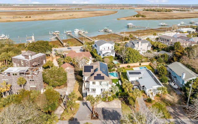 drone / aerial view with a water view and a residential view