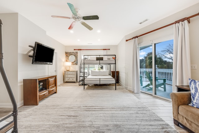 bedroom with access to outside, recessed lighting, multiple windows, and visible vents