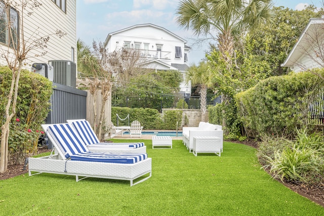 view of yard with an outdoor pool and fence