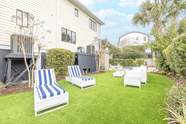 view of yard with fence and a fenced in pool