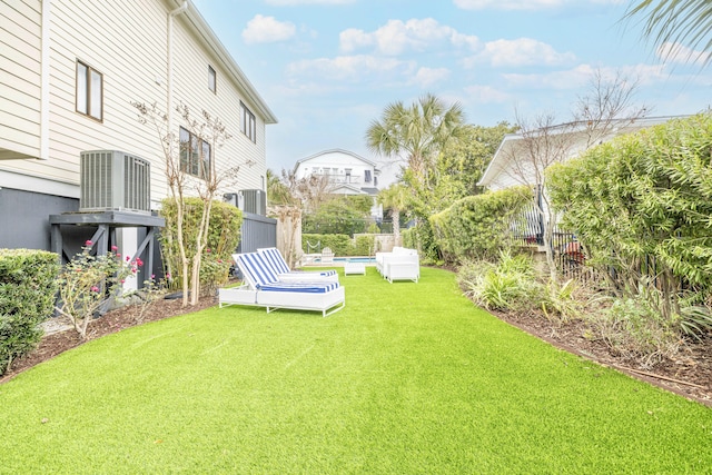 view of yard featuring an outdoor pool and fence