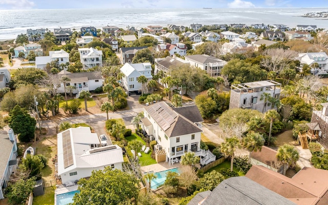 birds eye view of property with a water view and a residential view
